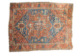 Antique Persian Karaja carpet with a brick red rectilinear medallion on a sky blue field.