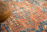 Antique Karaja rug's rectilinear Heriz pattern in brick red, sky blue, blush, low pile.