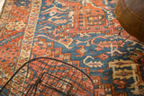 Antique Karaja carpet detail: rectilinear pattern, stylized leaves in sky blue, brick red.