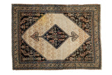 Antique Malayer Serab rug, navy and ivory diamond medallion, Herati and rams horn motifs, visible stain.