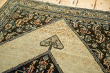 Antique Malayer Serab rug's rams horn motif on a beige tonal field with ornate elements.