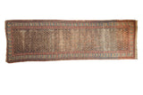 Antique Caucasian Soumac runner, geometric shrub motifs madder red and navy, visible wear, 3'8