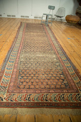 Original macrame fringe and colorful geometric borders of the antique Soumac runner.