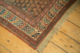 Antique Caucasian Soumac runner corner, displaying geometric border patterns and original macram fringe.