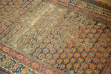 Antique Caucasian Soumac runner's repeating geometric shrub pattern with worn foundation, madder red, and teal tones.