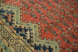 Detail of antique Malayer runner: geometric spandrel, blush red boteh field with abrashes.