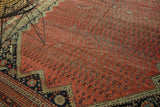 Antique Malayer runner corner, rich blush red field with repeating boteh, navy border with floral cross sections.