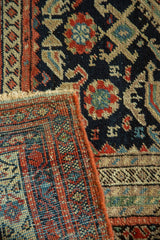 Antique Malayer runner's hand-knotted pile, intricate blush red pattern, and reverse foundation.