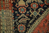 Hand-knotted antique Malayer runner's field with stylized turtles, floral motifs, and abrashes.