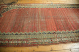 Antique Malayer runner end with serrated field, diverse floral border motifs, and natural abrashes.