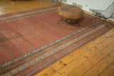 Antique Persian Malayer runner with cinnabar red boteh field and contrasting borders.
