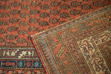 Antique Malayer rug runner's repeating cinnabar boteh pattern and intricate reverse weave.