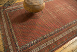 Antique Malayer runner's detailed inner minor border with contrasting ivory, blue, and brick red motifs.