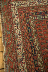 Antique Malayer rug borders with contrasting ivory, red, and blue geometric designs.
