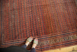 Antique Malayer runner with variegated brick red field, intricate shrub boteh, and multi-banded border.