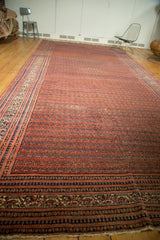 Antique Malayer runner end, showcasing intricate hand-knotted borders in brick red and sky blue.