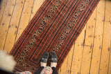 Antique Malayer runner's intricate Serbend vinery and boteh patterns, brick red and blue.