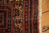Professional seam on antique Malayer rug: brick red, ivory, blue vinery, botehs, and knot heads.