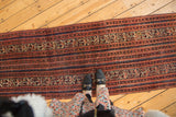 Antique Persian Malayer runner with meandering ivory vine, floral, and red-blue Serbend bands.