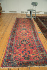 Vintage Lilihan runner with raspberry red field, delicate vinery, and floral palmettes.