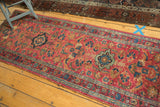 Vintage Persian Lilihan runner, raspberry red field, delicate vinery, and floral palmettes.