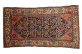 Antique Malayer rug: navy field, allover floral vinery, scattered animals, coral and ivory borders, 4x7'6