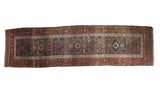 Antique Belouch runner featuring triple medallions, geometric field in navy blue, copper, and ivory.