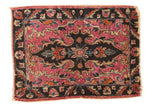 Antique Persian Lilihan rug mat with a dramatic fuchsia medallion, dark field, and rococo floral patterns. 2'1