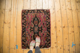 Early 20th century Lilihan rug mat, dramatic rococo medallion, fuchsia, black, and teal hues.