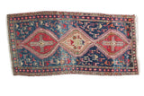 Vintage Caucasian Soumac rug runner with triple medallion and tribal figures in navy, red, beige.