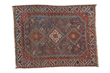 Antique Qashqai square rug with a triple diamond medallion in navy blue, brick red, and saffron yellow.