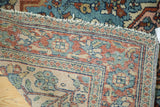 Persian Lilihan rug corner with intricate aqua, blush, beige lotus motifs and light tatter.