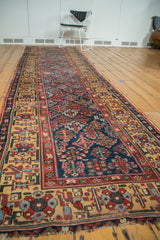 Antique Kurdish runner's intricate saffron yellow border and navy Garden of Paradise field.