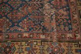 Antique Kurdish runner detail: navy Garden of Paradise motif and madder red border.