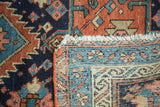 Antique Karaja rug, showing its hand-knotted geometric pile in navy, madder red, woven foundation, and fringe.