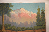 Textured pink mountain peak, light blue sky, tall green trees, and small hole on vintage painting.