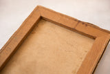 Back view of the vintage painting, showing the wooden stretcher frame and aged canvas.