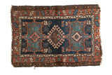 Antique North West Persian Karaja rug, geometric medallions in denim blue, mallard green, terra cotta.