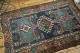 Antique Karaja rug left side with geometric blue, green, terra cotta patterns, fringe tatter.