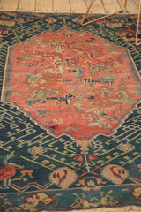 Antique Armenian Seichor Kuba rug: blush medallion, hook and vines, deep indigo geometric border.