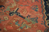 Antique Seichor Kuba rug displaying madder red field, oxidized green, and navy geometric floral motifs.