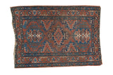 Antique Fine Heriz rug, triple medallion, rich brick red and deep blue geometric patterns.