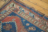 Caucasian rug corner with geometric madder red, sky blue patterns and minor plain weave tatter.