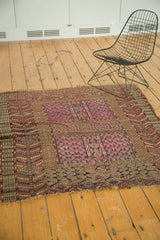 Geometric crab border and fringed end of the antique Turkmen rug.
