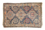 Antique Caucasian Soumac carpet with octagonal and diamond medallions. Navy, blush, ivory tones, 6'4