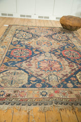 Antique Caucasian Soumac's intricate geometric medallions and barber pole borders.