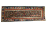 Antique Kuba Caucasian rug, early 20th century, with geometric panel motif and madder red boteh border.