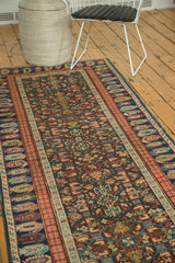 Antique Kuba Caucasian rug's geometric panel motif and madder root red boteh border.