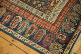 Antique Kuba Caucasian runner's navy blue main border with colorful boteh motifs.