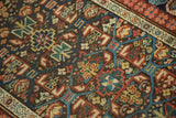 Geometric panel motif detail of antique Kuba Caucasian runner, madder red, blue, aged pile.